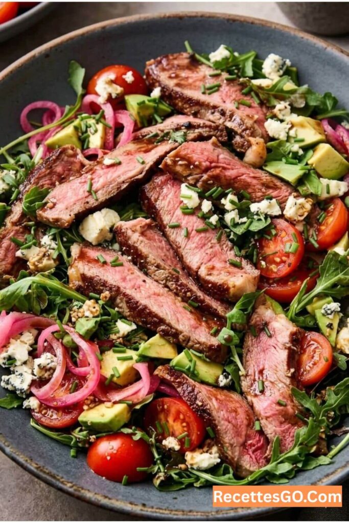A beef steak salad recipe that actually eats like a full meal. Grilled steak, arugula, pickled red onions, blue cheese, and balsamic dressing. Your new go-to summer salad for weeknights and backyard get-togethers.